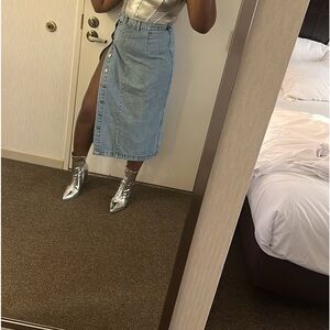 Long denim skirt with buttons. Medium wash